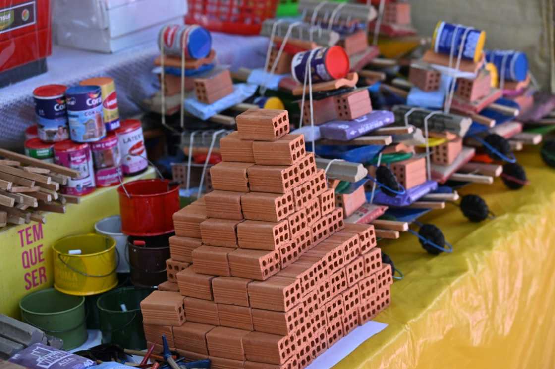 Miniature items for sale include bricks, paint and other construction materials Miniature items for sale include bricks, paint and other construction materials