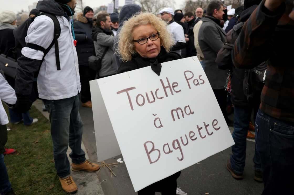 Joelle Reimel, a 56-year-old baker with nearly 30 years experience, wore a sign around her neck that read: 'Don't touch my baguette'. Joelle Reimel, a 56-year-old baker with nearly 30 years experience, wore a sign around her neck that read: 'Don't touch my baguette'.