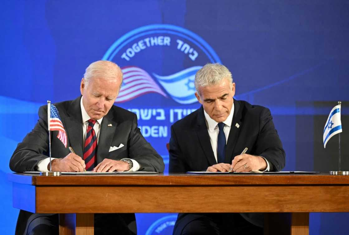US President Joe Biden and Israel's caretaker Prime Minister Yair Lapid sign a security pledge in Jerusalem on July 14 US President Joe Biden and Israel's caretaker Prime Minister Yair Lapid sign a security pledge in Jerusalem on July 14