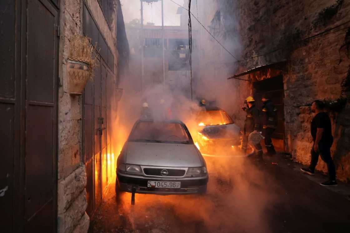 Palestinian rescue teams rush to the scene of clashes between Israeli troops and Palestinian gunmen in the Old City of Nablus in the northern occupied West Bank early on July 24, 2022 Palestinian rescue teams rush to the scene of clashes between Israeli troops and Palestinian gunmen in the Old City of Nablus in the northern occupied West Bank early on July 24, 2022