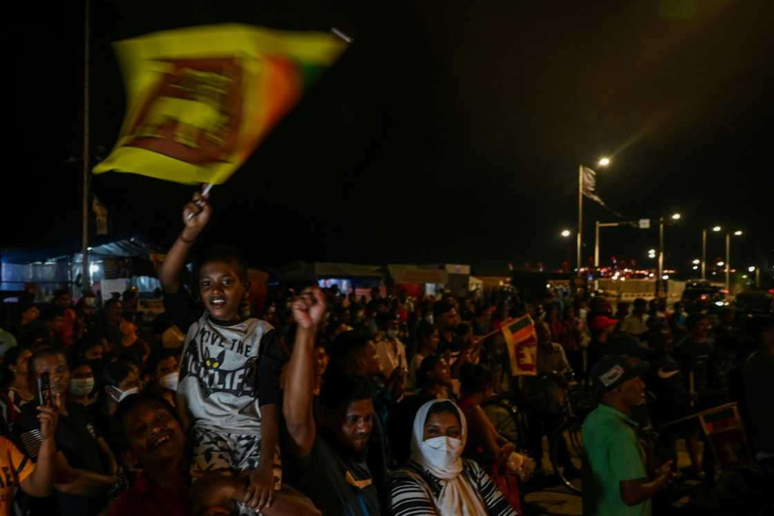Jubilant protesters celebrate after the ouster of Sri Lankan president Gotabaya Rajapaksa