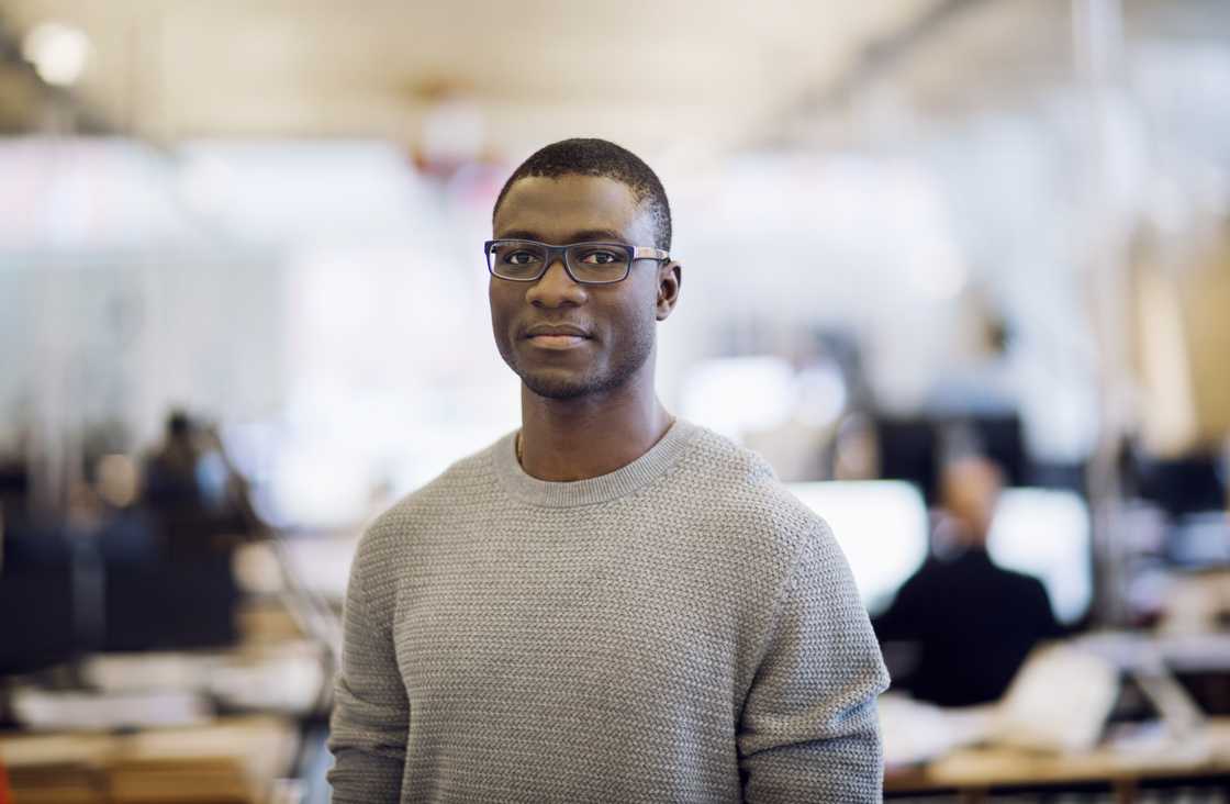 A man in a grey sweater A man in a grey sweater