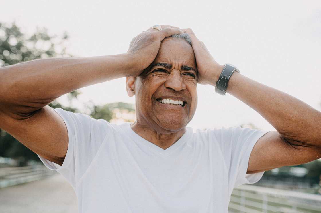 A man hodling his head A man hodling his head