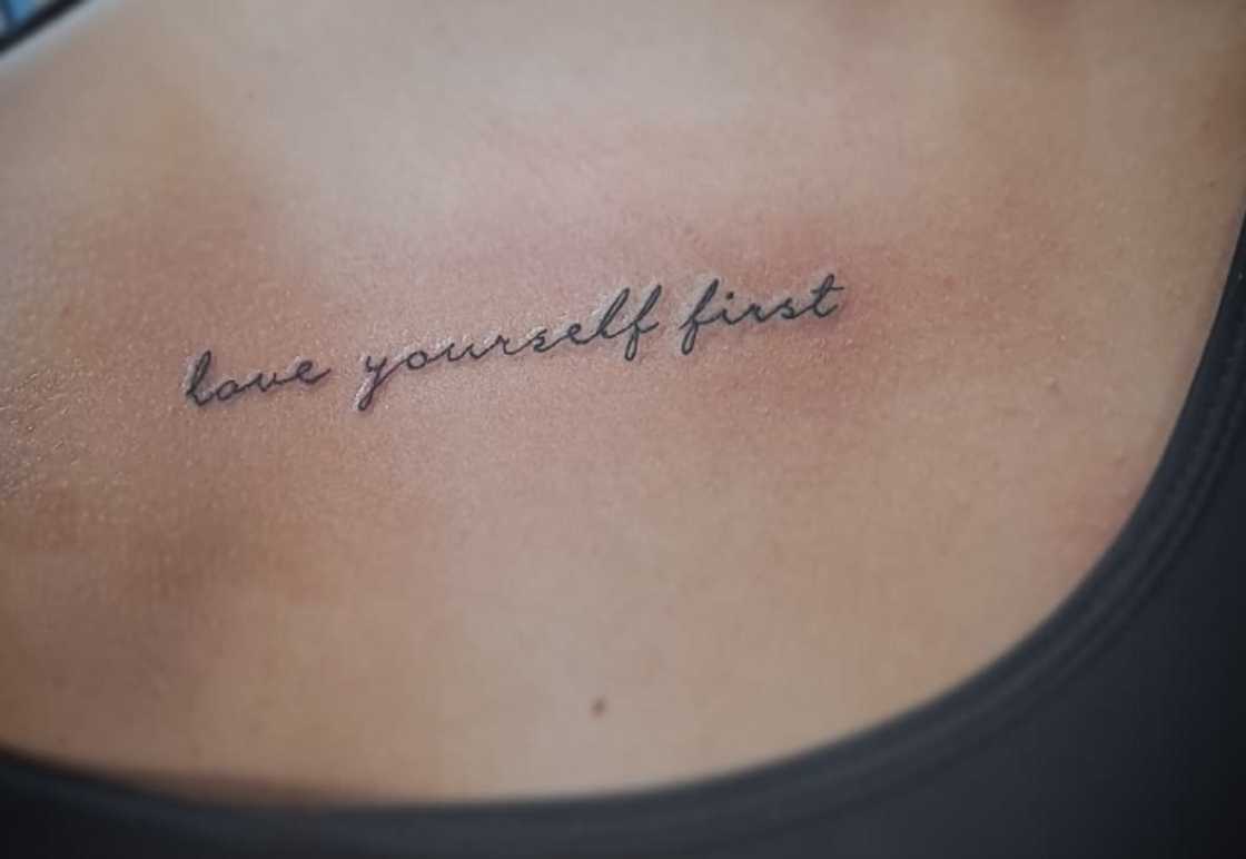 Love Yourself first cursive collarbone tattoo Love Yourself first cursive collarbone tattoo