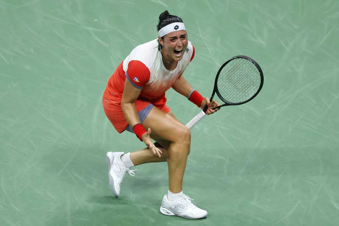 Tunisia's Ons Jabeur celebrates after defeating Caroline Garcia to reach the US Open final on Thursday