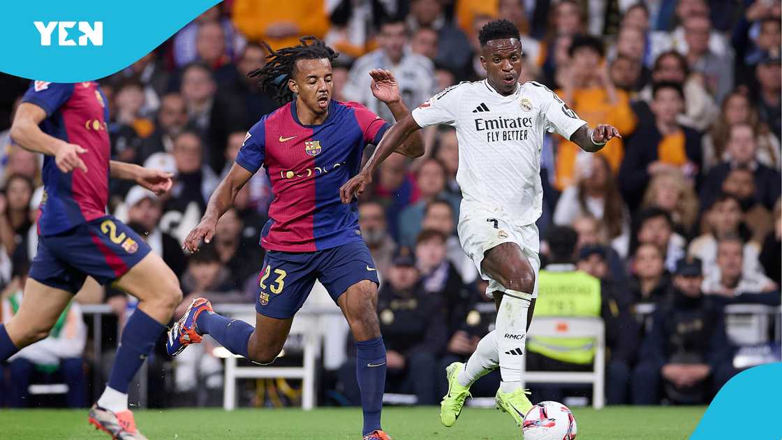 Jules Kounde of Barcelona challenges Vinicius Jr of Real Madrid for the ball during the Real Madrid 0 Barcelona 4 2024/25 La Liga El Clasico. Jules Kounde of Barcelona challenges Vinicius Jr of Real Madrid for the ball during the Real Madrid 0 Barcelona 4 2024/25 La Liga El Clasico.