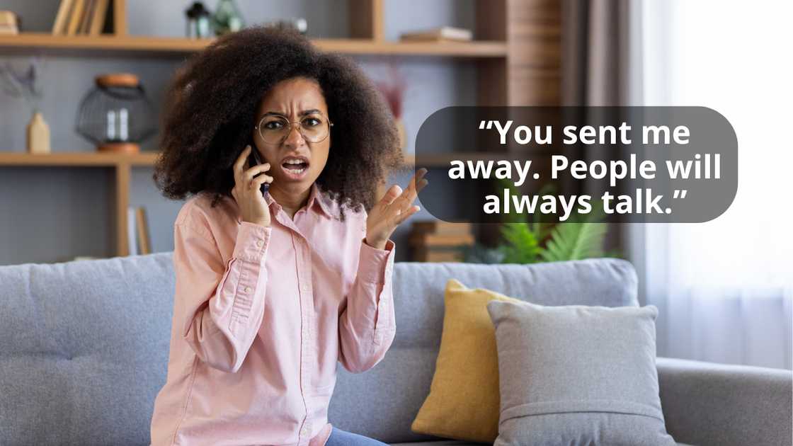 An upset woman sitting on a couch talking on the phone An upset woman sitting on a couch talking on the phone