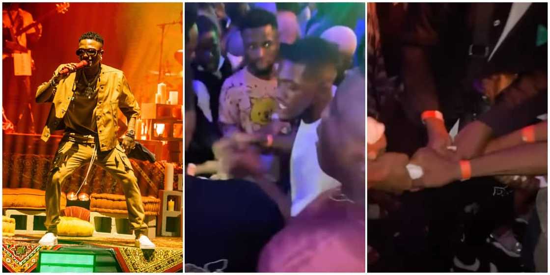 Men burn and share Wizkid's sweaty towel after catching it during his performance in Warri, video stirs reactions Men burn and share Wizkid's sweaty towel after catching it during his performance in Warri, video stirs reactions