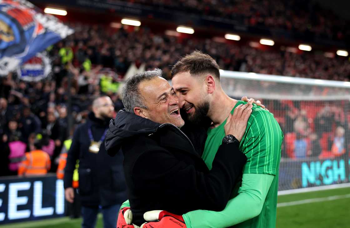 Luis Enrique, Head Coach of PSG, and Gianluigi Donnarumma of Paris Saint-Germain celebrate after the team's victory in the UEFA Champions League 2024/25 R16 2nd leg vs Liverpool at Anfield on March 11, 2025 in Liverpool, England Luis Enrique, Head Coach of PSG, and Gianluigi Donnarumma of Paris Saint-Germain celebrate after the team's victory in the UEFA Champions League 2024/25 R16 2nd leg vs Liverpool at Anfield on March 11, 2025 in Liverpool, England