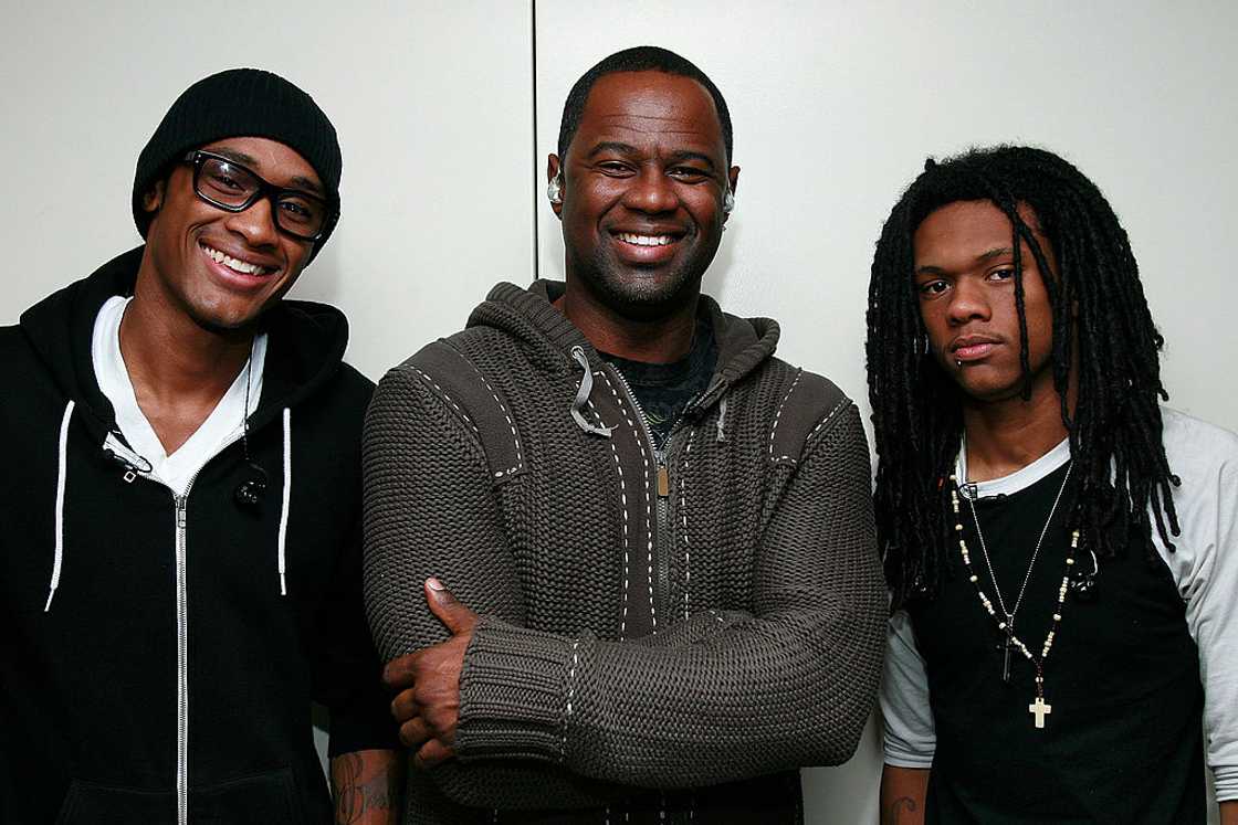 Niko McKnight (R) standing with his father (M) and Brian Jr (L)