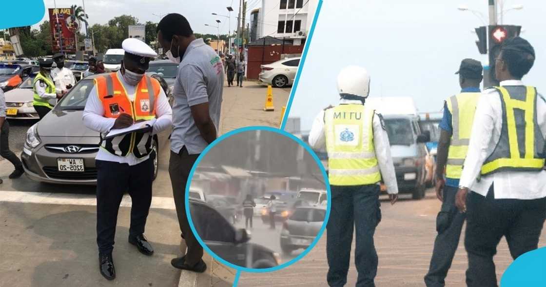 police officer, mttd, rainfall, rain fall, heavy rain, abeka junction, ghana, traffic, two police officers at Abeka Junction