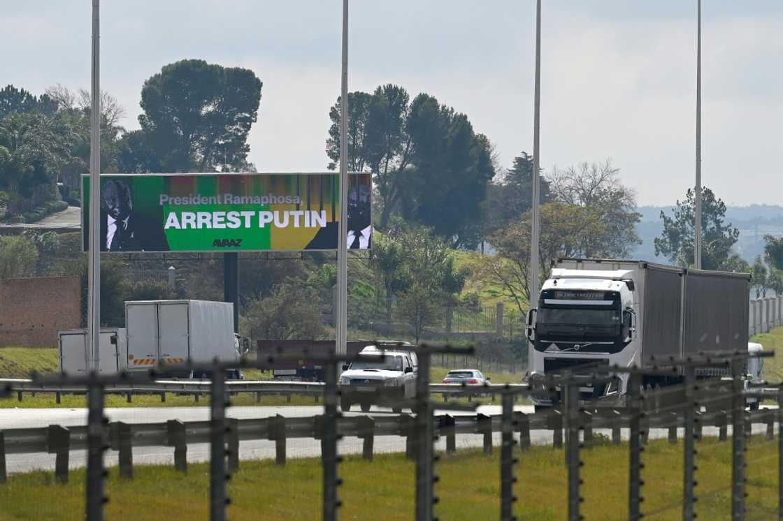 A billboard by activist group Avaaz near Centurion, South Africa, seen in May 2023 urges President Cyril Ramaphosa to arrest his Russian counterpart Vladimir Putin if he attends an August summit of emerging BRICS economies