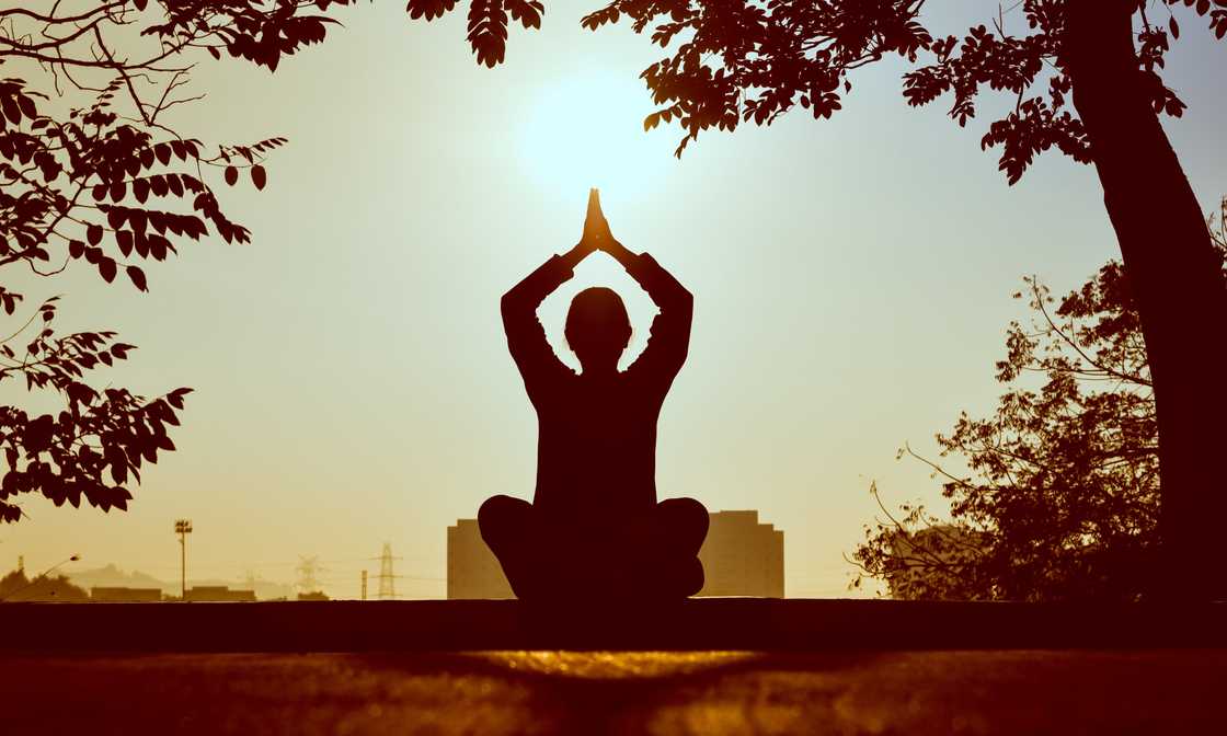 A person in a meditating posture