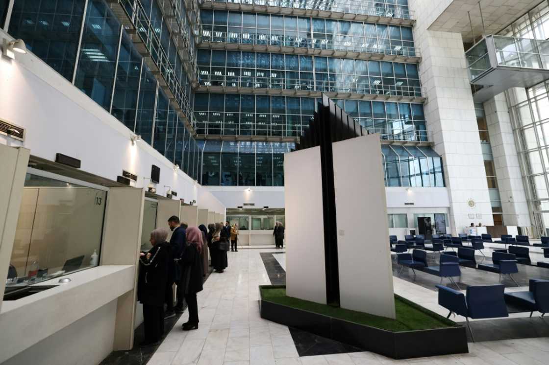 Customers at the Central Bank of Iraq, which says many foreign trade transactions now go through its electronic platform Customers at the Central Bank of Iraq, which says many foreign trade transactions now go through its electronic platform