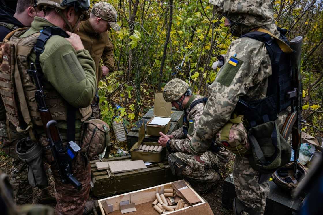 Ukrainian servicemen check their ammunition at a position on the front line in eastern Ukraine's Donetsk region Ukrainian servicemen check their ammunition at a position on the front line in eastern Ukraine's Donetsk region
