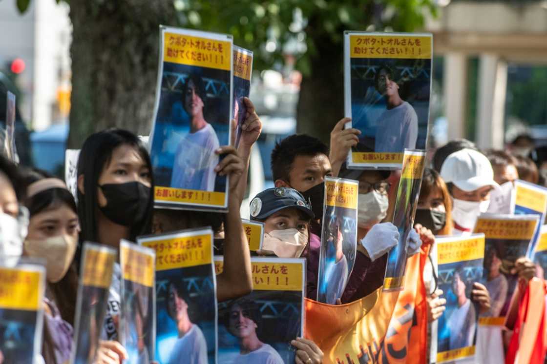 A small crowd rallied outside Japan's foreign ministry in Tokyo, holding placards of Kubota A small crowd rallied outside Japan's foreign ministry in Tokyo, holding placards of Kubota