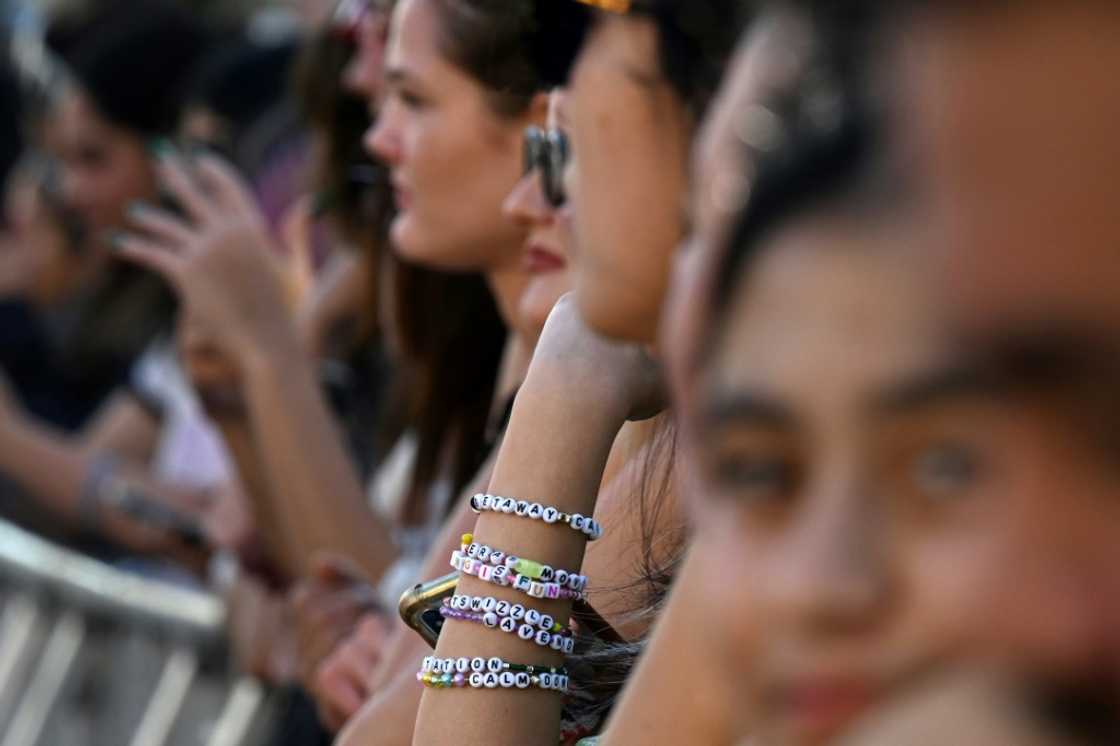 Fans gather outside the "Taylor Swift: The Eras Tour" concert movie world premiere at AMC The Grove in Los Angeles