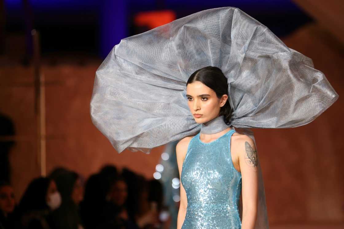 A model walks the catwalk at this year's Riyadh Fashion Week, a milestone in a country that used to require women to wear hijab headscarves and abaya robes in public A model walks the catwalk at this year's Riyadh Fashion Week, a milestone in a country that used to require women to wear hijab headscarves and abaya robes in public