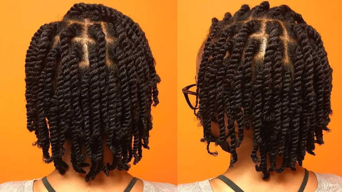 A woman in Short fluffy kinky twists