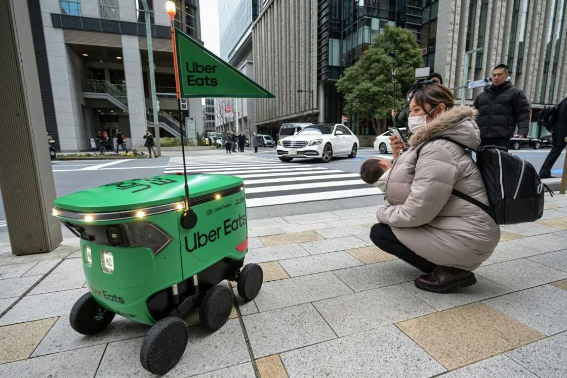 The Uber Eats robots, developed with Mitsubishi Electric and US start-up Cartken, will deliver food from just a few restaurants in the busy Nihonbashi district at first The Uber Eats robots, developed with Mitsubishi Electric and US start-up Cartken, will deliver food from just a few restaurants in the busy Nihonbashi district at first