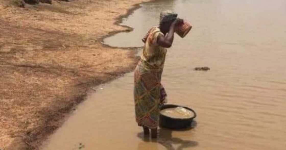 Many React as Netizen Hails a Woman for Drinking Mud Water Many React as Netizen Hails a Woman for Drinking Mud Water