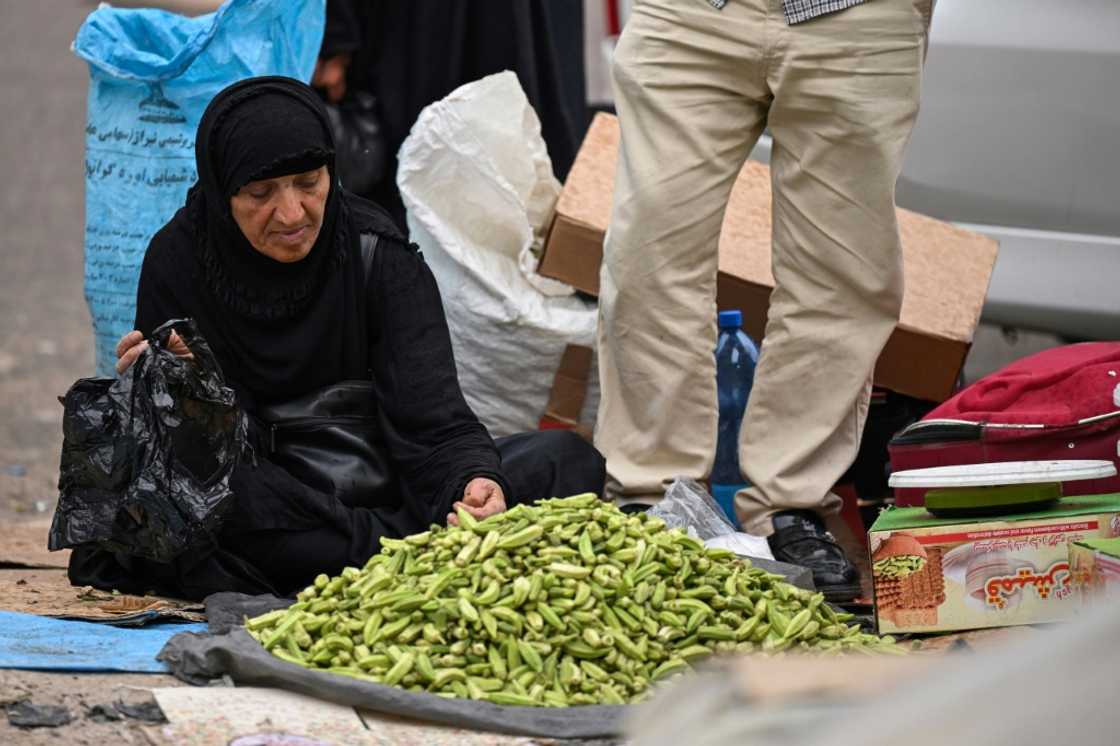 An Iranian woman sells okra at the old market in Iraq's southern city of Basra An Iranian woman sells okra at the old market in Iraq's southern city of Basra