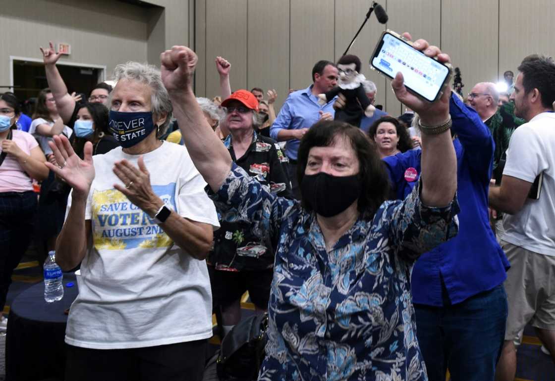 Pro-abortion rights supporters cheer as voting results show Kansas has voted to maintain the statewide right to abortion, in Overland Park, Kansas Pro-abortion rights supporters cheer as voting results show Kansas has voted to maintain the statewide right to abortion, in Overland Park, Kansas