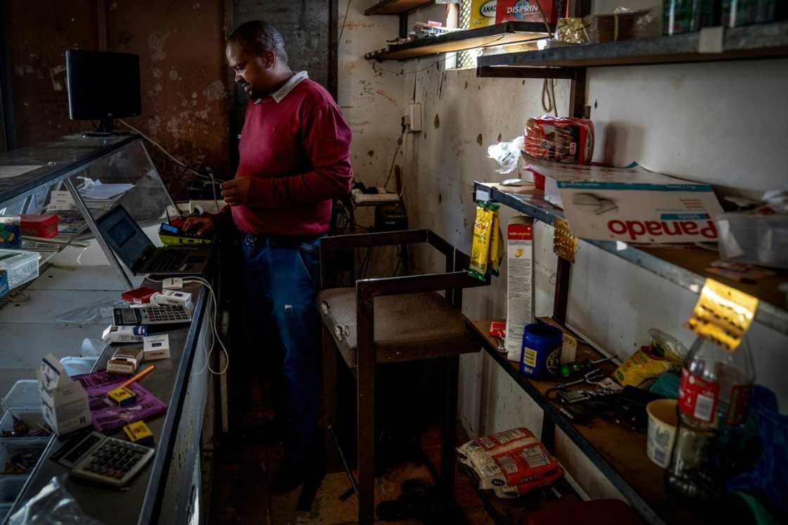 Shopkeeper Thando Keswa said he had had to shut down his takeaway business as he could no longer afford to use a generator to provide power Shopkeeper Thando Keswa said he had had to shut down his takeaway business as he could no longer afford to use a generator to provide power