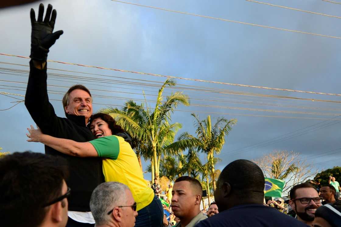 Brazilian President Jair Bolsonaro (R) is seeking a second term in October 2022 presidential elections Brazilian President Jair Bolsonaro (R) is seeking a second term in October 2022 presidential elections