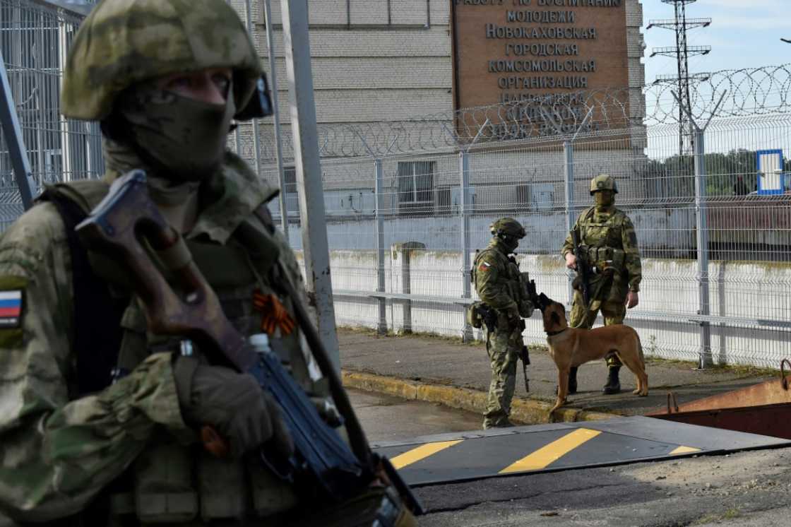 Russian servicemen patrol near the Kakhovka Hydroelectric Power Plant in occupied Kherson Russian servicemen patrol near the Kakhovka Hydroelectric Power Plant in occupied Kherson