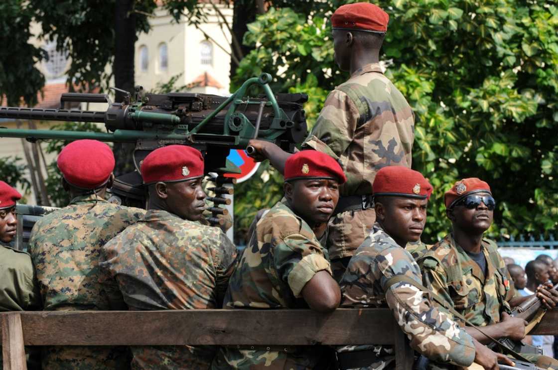 Red Beret troops of the presidental guard in central Conakry just days after the 2009 stadium massacre Red Beret troops of the presidental guard in central Conakry just days after the 2009 stadium massacre