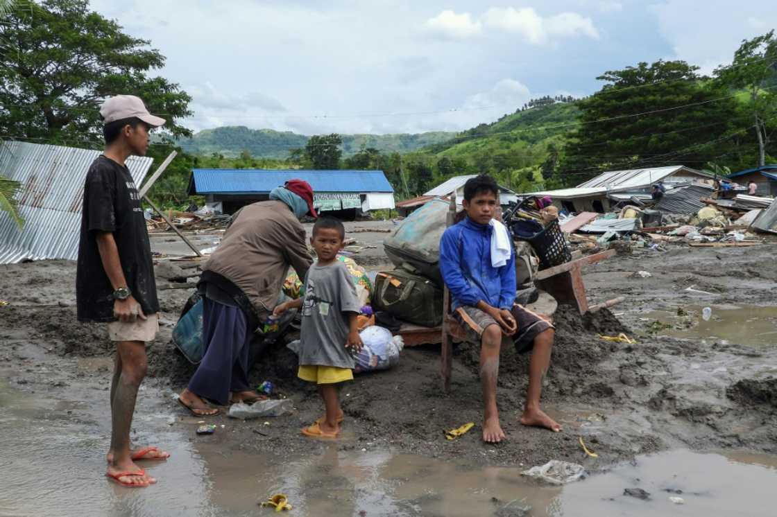 Fourteen bodies have been recovered from the village so far. They are among 40 confirmed deaths in a series of flash floods and landslides ahead of Nalgae's landfall Fourteen bodies have been recovered from the village so far. They are among 40 confirmed deaths in a series of flash floods and landslides ahead of Nalgae's landfall