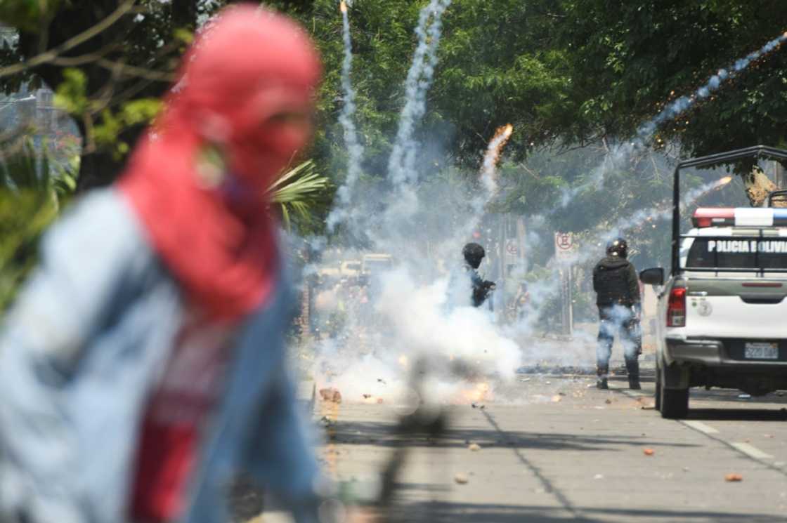 Police fire tear gas canisters at protesters in the streets of Santa Cruz, Bolivia, on November 11, 2022 Police fire tear gas canisters at protesters in the streets of Santa Cruz, Bolivia, on November 11, 2022