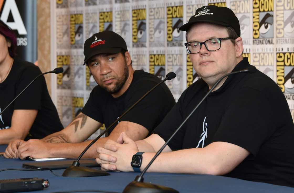 Zeke Alton (L) and SAG-AFTRA's chief negotiator Duncan Crabtree-Ireland attend a Comic-Con press junket