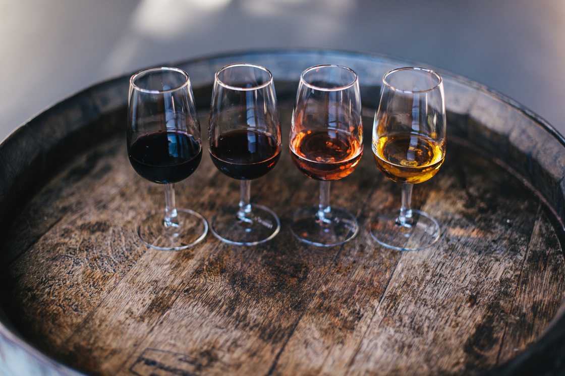 Port wine glasses on a wooden tray