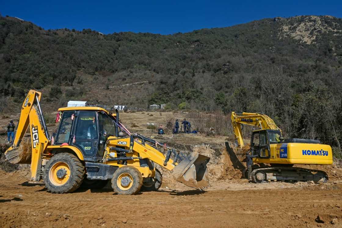 Workers use excavators at the construction site of a cable transportation system, leading to the Pathibhara Devi temple at Taplejung district, in Koshi province of Nepal Workers use excavators at the construction site of a cable transportation system, leading to the Pathibhara Devi temple at Taplejung district, in Koshi province of Nepal