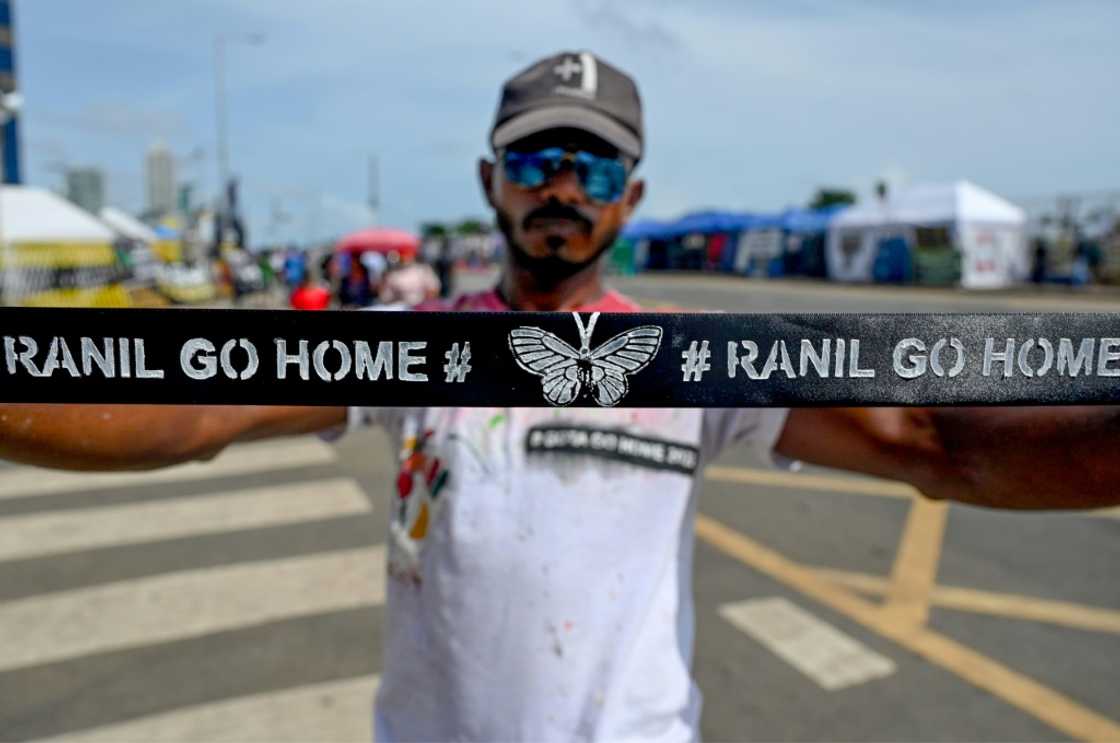 A demonstrator displays a headband with a slogan against interim Sri Lankan President Ranil Wickremesinghe during a demonstration near the Presidential secretariat in Colombo on July 17, 2022. A demonstrator displays a headband with a slogan against interim Sri Lankan President Ranil Wickremesinghe during a demonstration near the Presidential secretariat in Colombo on July 17, 2022.