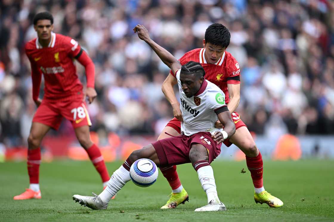 Mohammed Kudus of West Ham United holds off Wataru Endo of Liverpool during a PL match on April 13, 2025 in Liverpool, England Mohammed Kudus of West Ham United holds off Wataru Endo of Liverpool during a PL match on April 13, 2025 in Liverpool, England
