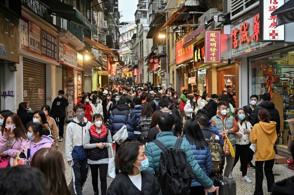 Mainland Chinese tourists filled Macau's streets, and stores selling local snacks like almond cookies and meat jerky had trouble keeping up Mainland Chinese tourists filled Macau's streets, and stores selling local snacks like almond cookies and meat jerky had trouble keeping up