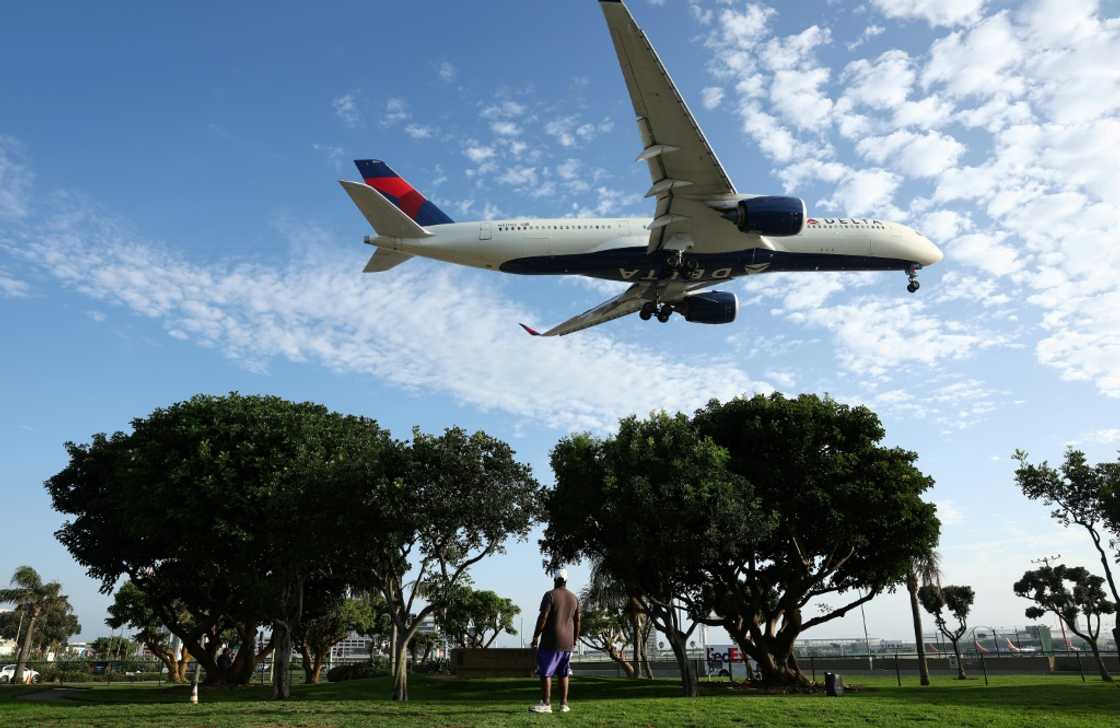 A woman who says she was threatened with being kicked off a Delta Air Lines flight for not wearing a bra is demanding a meeting with the company's boss A woman who says she was threatened with being kicked off a Delta Air Lines flight for not wearing a bra is demanding a meeting with the company's boss