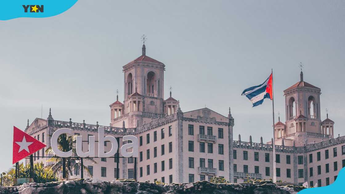 A building with the Cuban national flag in Havana A building with the Cuban national flag in Havana