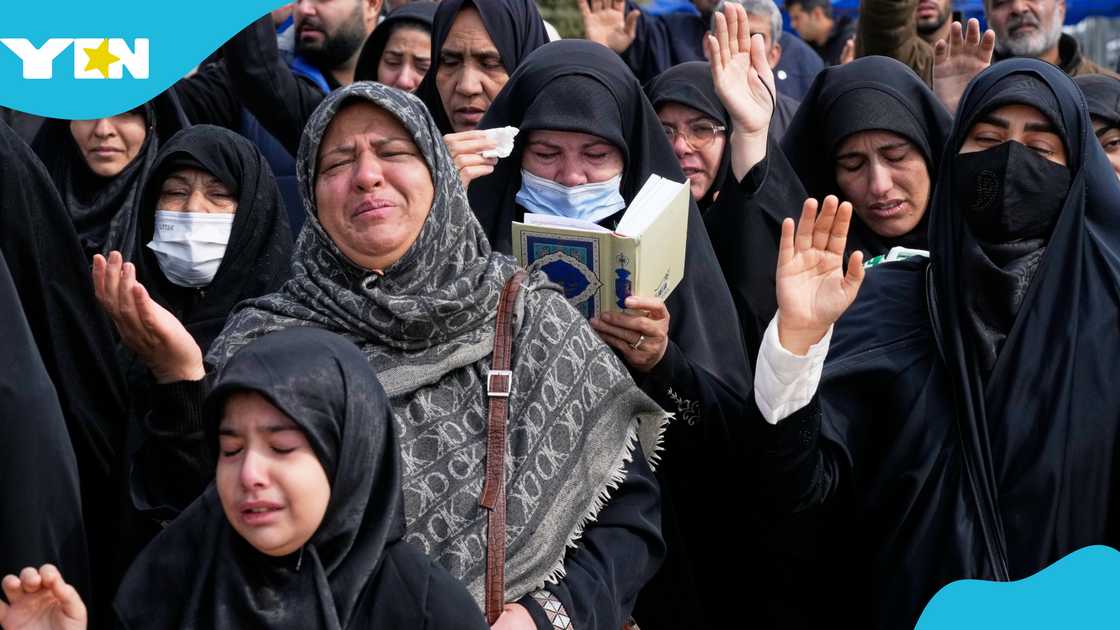 Mourners pray during the funeral of Mehdi Hosseini, a man killed in a U.S.-Israeli strike, at Behesht-e Zahra cemetery in Tehran, Iran, Monday, March 9, 2026. (AP Photo/Vahid Salemi)