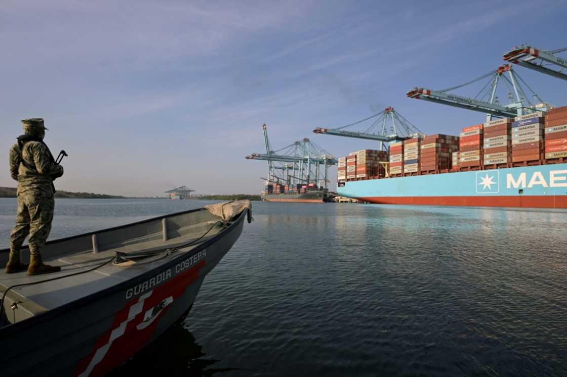 Members of the navy patrol the Lazaro Cardenas port on Mexico's Pacific coast