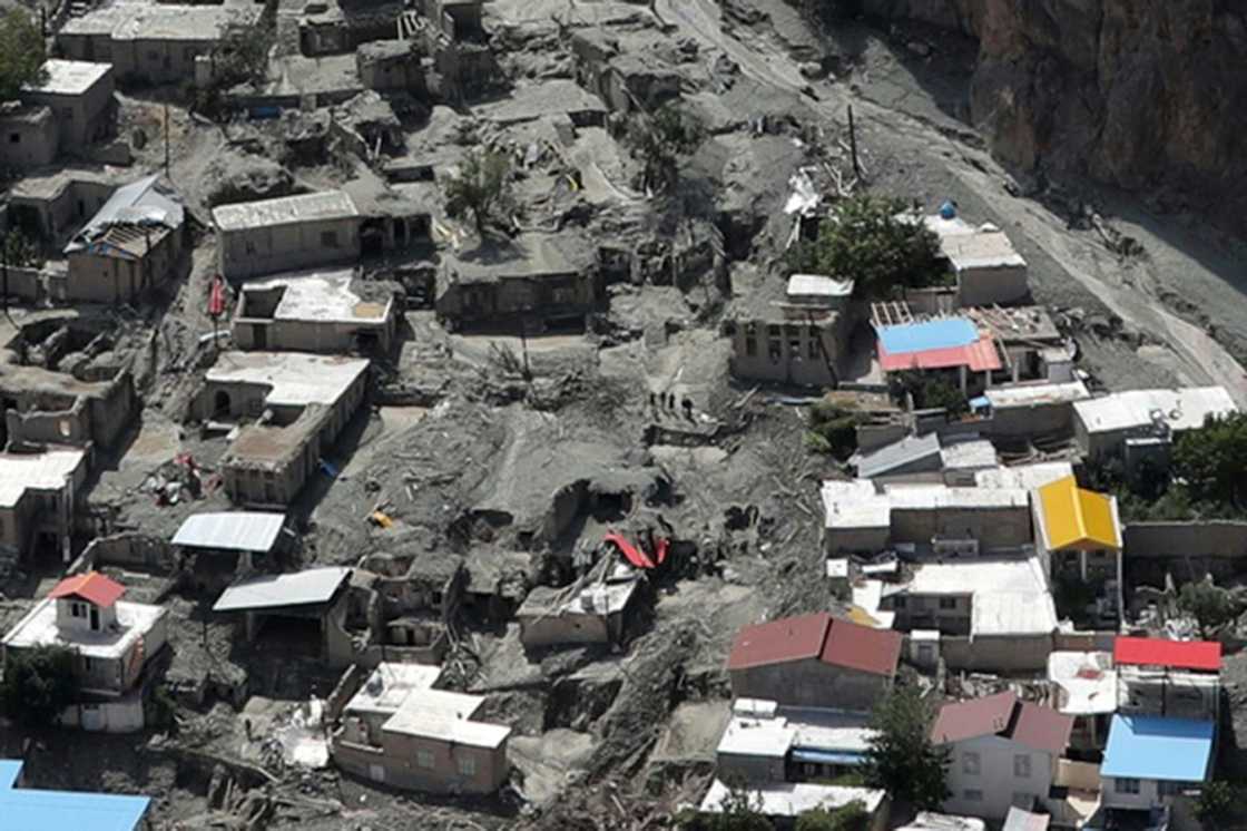 Houses surrounded by mud deposits at the site of a flash flood east of Tehran in the Firouzkouh area, where a landslide killed 14 people Houses surrounded by mud deposits at the site of a flash flood east of Tehran in the Firouzkouh area, where a landslide killed 14 people