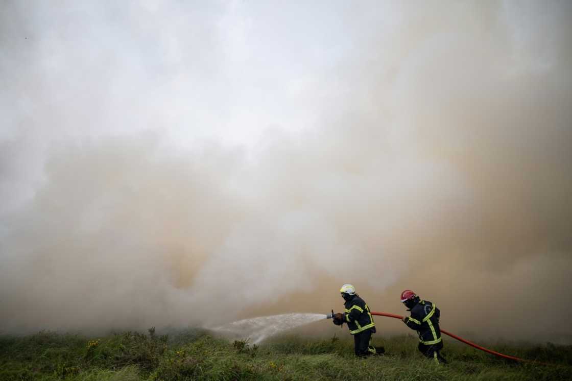 Cooler air swept into western Europe helping to bring fires under control