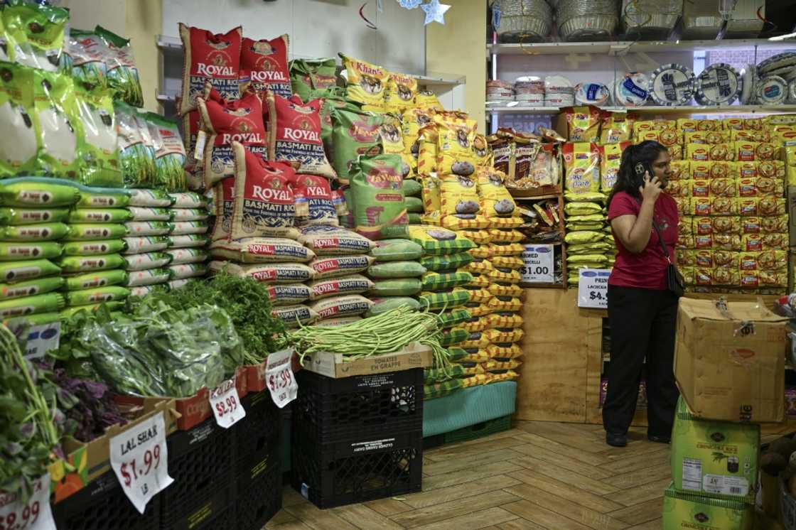 A person stands in a supermarket in the ‘Little India’ neighborhood of New York City A person stands in a supermarket in the ‘Little India’ neighborhood of New York City