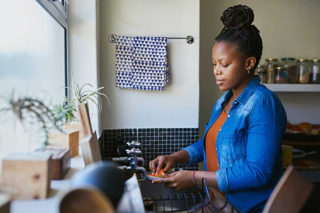 A woman by the sink
