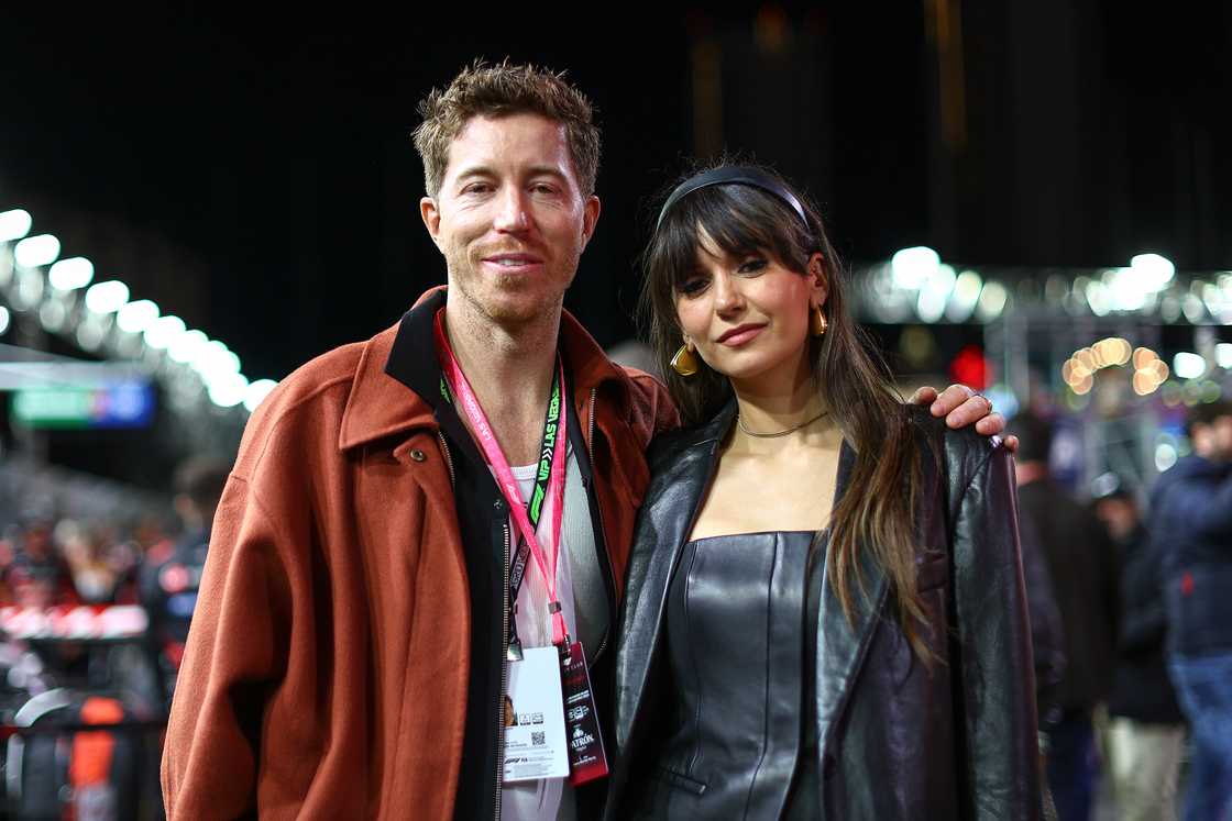 Shaun White and Nina Dobrev walk on the grid prior to the F1 Grand Prix of Las Vegas