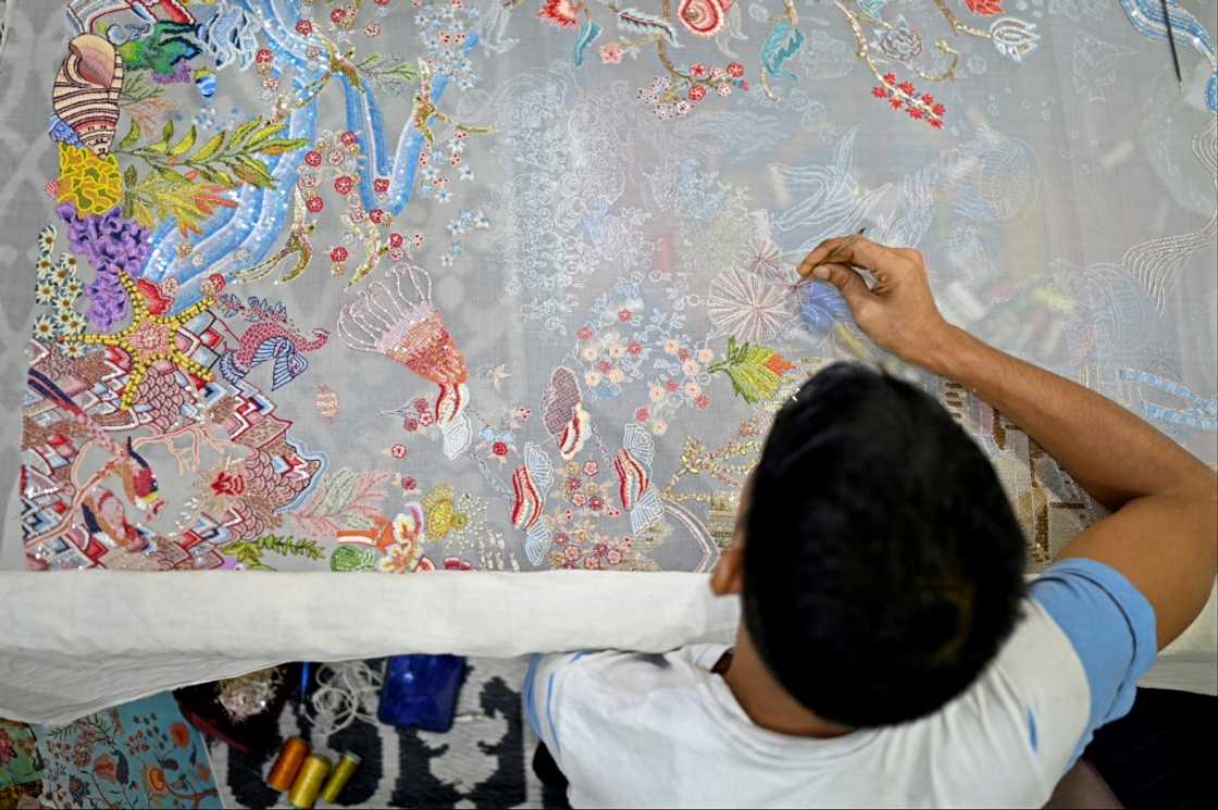 Intricate, tactile detail is a hallmark of Rahul Mishra's fashion, as seen at his workshop in Noida, India, near New Delhi Intricate, tactile detail is a hallmark of Rahul Mishra's fashion, as seen at his workshop in Noida, India, near New Delhi