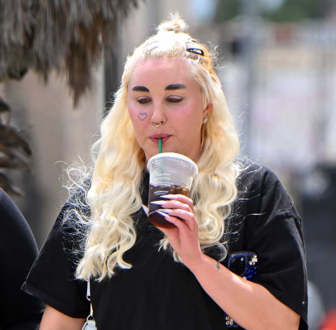 Amanda Bynes in a black t-shirt drinking coffee out and about in the streets of LA Amanda Bynes in a black t-shirt drinking coffee out and about in the streets of LA